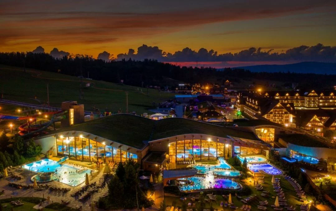 Aerial view of Chochołów Thermal Baths illuminated at sunset