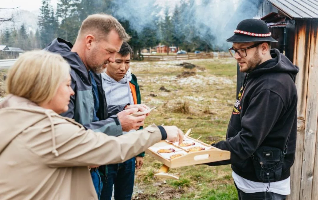 Local highland guide serving oscypek cheese and tasting samples to visitors